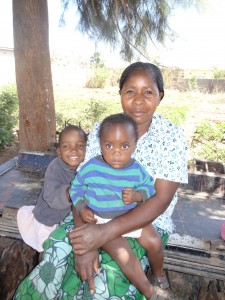 Auntie Agnes takes a break from laundry with Elina and Emely at Oz Kids Orphanage.