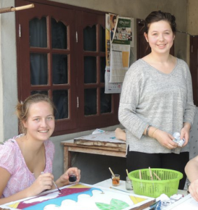 In our host family's home on a Thailand community service trip.